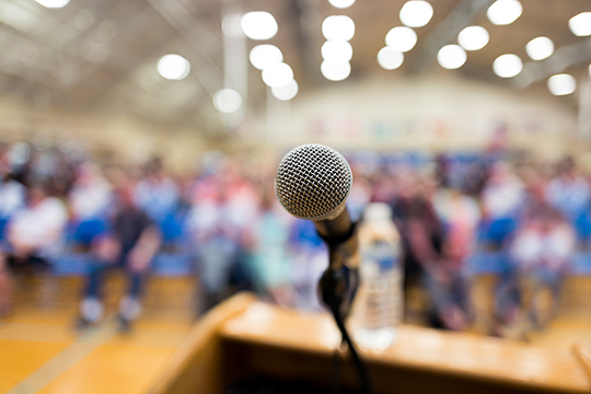 Microphone on a podium in an auditorium.