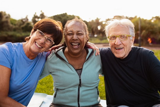 A group of older adults smiling.