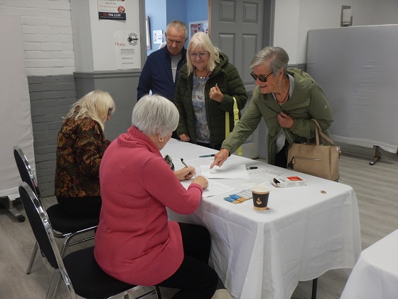 Member checking in at the reception desk